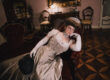 Grimilde Malatesta in Palazzo Facchi during a Historical Reverie event, photographed by Agnese Morganti. She's wearing her pearl butterfly edwardian dress, while leaning on a sofa.
