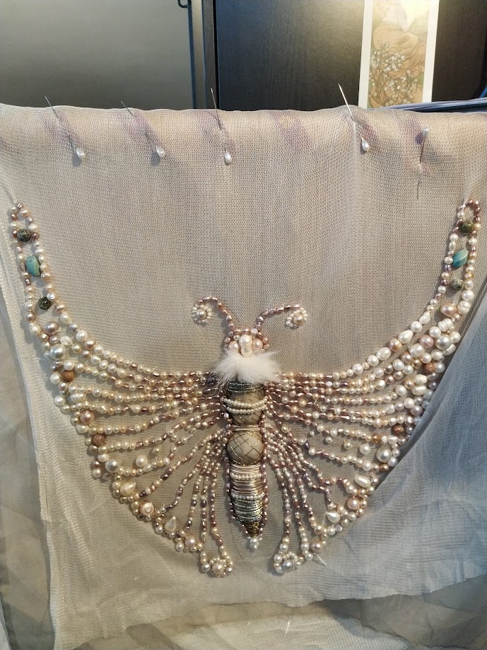 Embroidered pearl butterfly for an edwardian dress, ont he embroidery frame