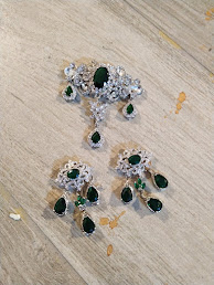 re-assembled cheap jewelry, in the shape of girandole earrings recalling 18th century style